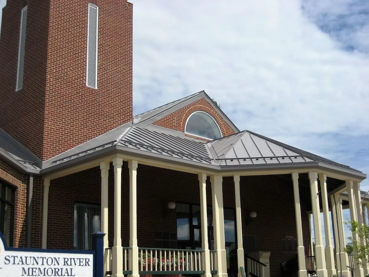 Skilled roofing craftsmen working on a residential roof in Maumelle